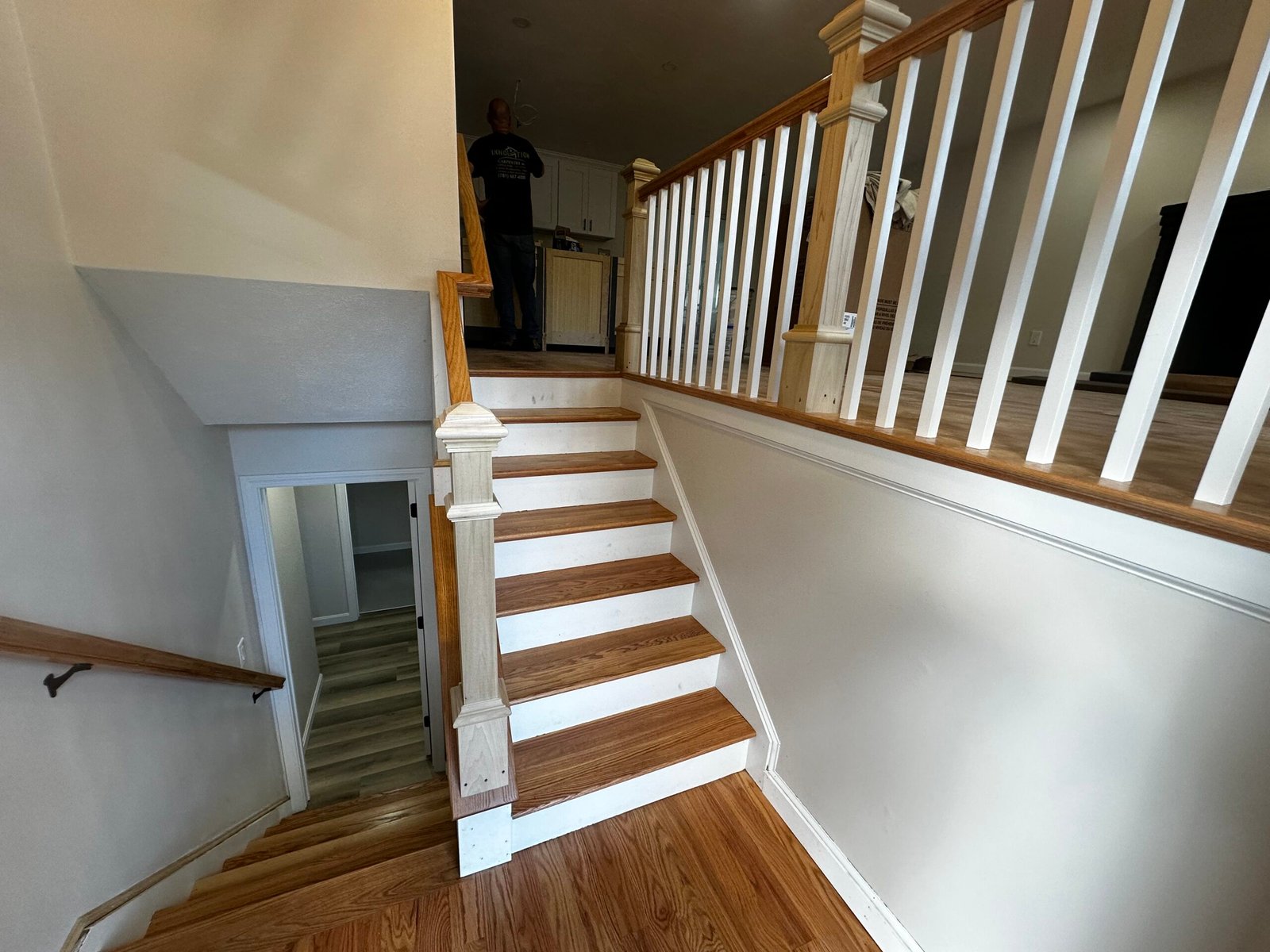 Skilled carpenter performing custom woodwork in a high-end Massachusetts home
