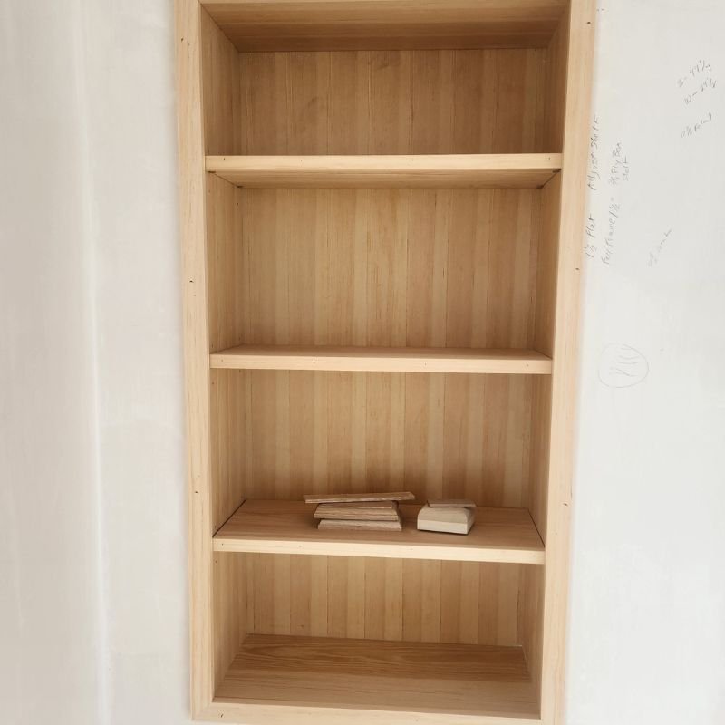 Classic wooden built-in bookcase with adjustable shelving