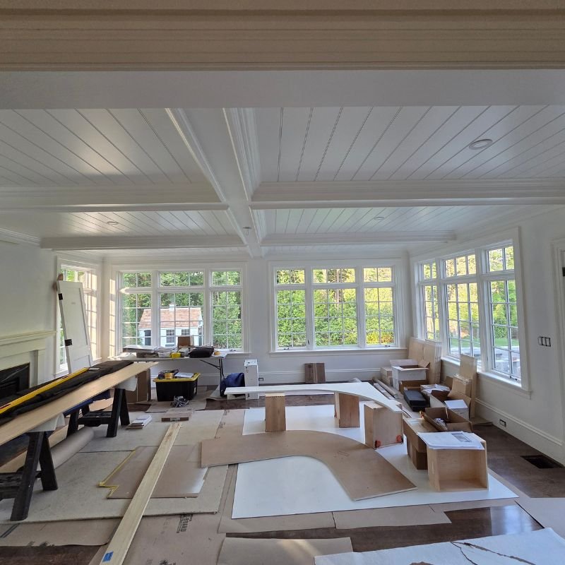 White custom built-in entertainment center in a contemporary living room